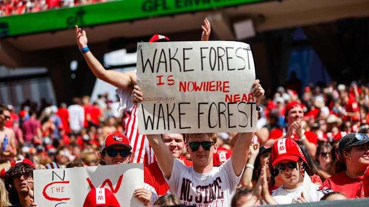 Oct 5, 2024; Raleigh, North Carolina, USA; North Carolina State Wolfpack fan with a sign during the first half of the game against Wake Forest Demon Deacons at Carter-Finley Stadium. Mandatory Credit: Jaylynn Nash-Imagn Images Oct 5, 2024; Raleigh, North Carolina, USA; North Carolina State Wolfpack fan with a sign during the first half of the game against Wake Forest Demon Deacons at Carter-Finley Stadium. Mandatory Credit: Jaylynn Nash-Imagn Images