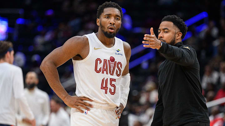 Oct 26, 2024; Washington, District of Columbia, USA; Cleveland Cavaliers guard Donovan Mitchell (45) speaks to Cleveland Cavaliers associate head coach Johnnie
Bryant during a time out in the third quarter against the Washington Wizards at Capital One Arena. Mandatory Credit: Reggie Hildred-Imagn Images