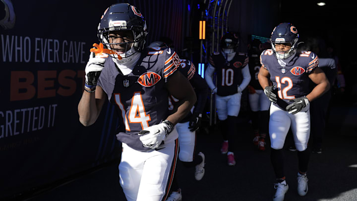 Dec 14, 2025; Chicago, Illinois, USA; Chicago Bears wide receiver Olamide Zaccheaus (14) and Chicago Bears wide receiver Devin Duvernay (12) run onto the field for warmups prior to the game against the Cleveland Browns at Soldier Field.