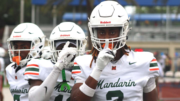 Mandarin defensive backs Tamajh Mitchell (7), Shareef Jackson (12) and Brody Jennings (3) line up before a high school spring football game at Bolles on May 22, 2025. [Clayton Freeman/Florida Times-Union]