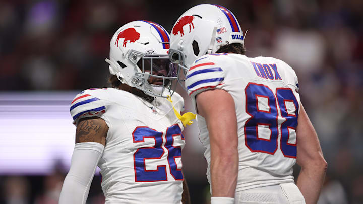 Buffalo Bills tight end Dawson Knox celebrates a touchdown catch with running back Ty Johnson.