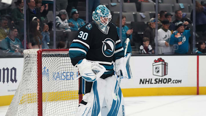 Dec 19, 2024; San Jose, California, USA;  San Jose Sharks goaltender Yaroslav Askarov (30) warms up before the game against the Colorado Avalanche at SAP Center at San Jose. Mandatory Credit: David Gonzales-Imagn Images