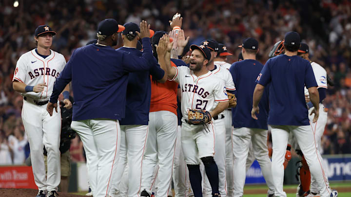 Sep 24, 2024; Houston, Texas, USA; Houston Astros second baseman Jose Altuve (27) and teammates celebrate defeating the Seattle Mariners and winning the American League West at Minute Maid Park. Sep 24, 2024; Houston, Texas, USA; Houston Astros second baseman Jose Altuve (27) and teammates celebrate defeating the Seattle Mariners and winning the American League West at Minute Maid Park.