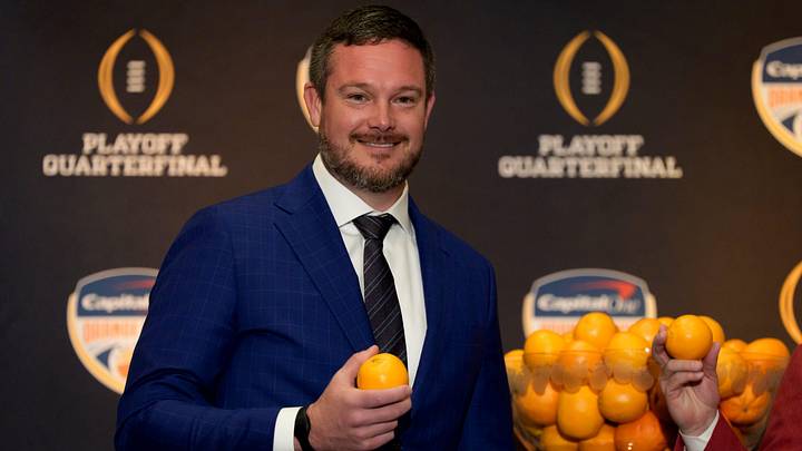 Oregon head coach Dan Lanning holds an orange during the head coaches press conference ahead of Orange Bowl on Dec. 31, 2025, in Dania Beach, Florida.