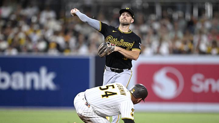 Pittsburgh Pirates second baseman Brandon Lowe throws over San Diego Padres catcher Freddy Fermin.