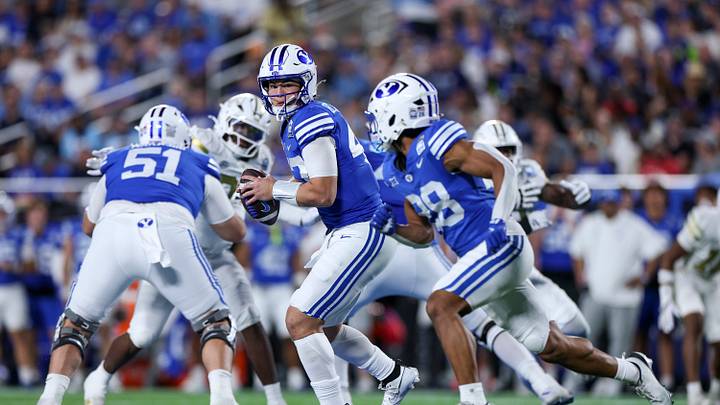 Dec 27, 2025; Orlando, FL, USA; BYU Cougars quarterback Bear Bachmeier (47) looks to hand off against the Georgia Tech Yellow Jackets in the third quarter during the Pop-Tarts Bowl at Camping World Stadium. Mandatory Credit: Nathan Ray Seebeck-Imagn Images Dec 27, 2025; Orlando, FL, USA; BYU Cougars quarterback Bear Bachmeier (47) looks to hand off against the Georgia Tech Yellow Jackets in the third quarter during the Pop-Tarts Bowl at Camping World Stadium. Mandatory Credit: Nathan Ray Seebeck-Imagn Images