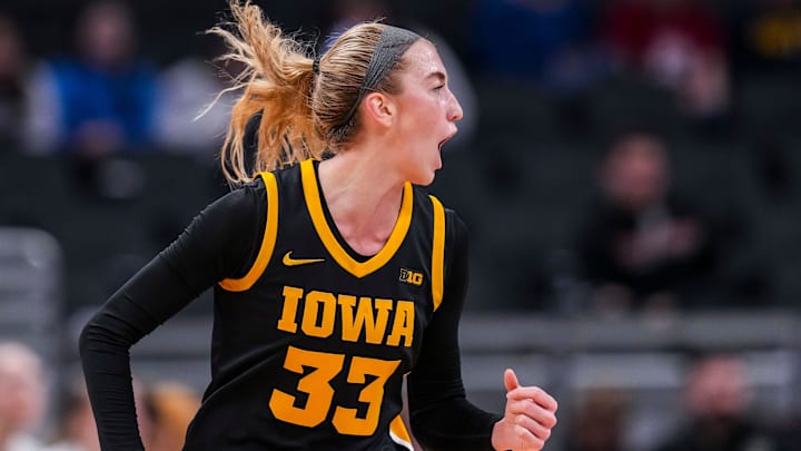 Iowa Hawkeyes guard Lucy Olsen (33) celebrates after scoring Thursday, March 6, 2025, in a round two game at the 2025 TIAA Big Ten Women's Basketball Tournament between the Iowa Hawkeyes and the Michigan State Spartans at Gainbridge Fieldhouse in Indianapolis.