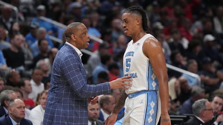 UNC basketball head coach Hubert Davis and big man Armando Bacot