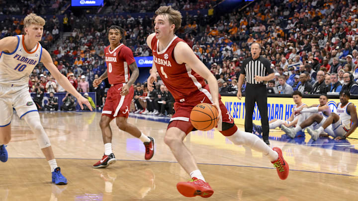 Mar 15, 2025; Nashville, TN, USA; Alabama Crimson Tide forward Grant Nelson (4) drives to the basket against the Florida Gators during the first half at Bridgestone Arena. Mandatory Credit: Steve Roberts-Imagn Images Mar 15, 2025; Nashville, TN, USA; Alabama Crimson Tide forward Grant Nelson (4) drives to the basket against the Florida Gators during the first half at Bridgestone Arena. Mandatory Credit: Steve Roberts-Imagn Images