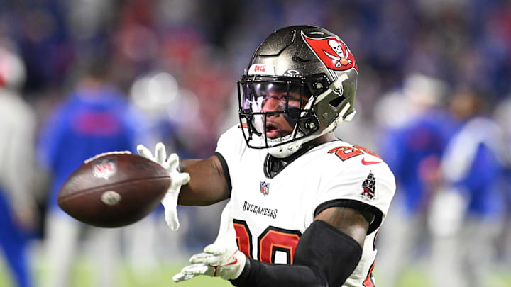 Tampa Bay Buccaneers safety Christian Izien warms up before a game against the Buffalo Bills. Tampa Bay Buccaneers safety Christian Izien warms up before a game against the Buffalo Bills.