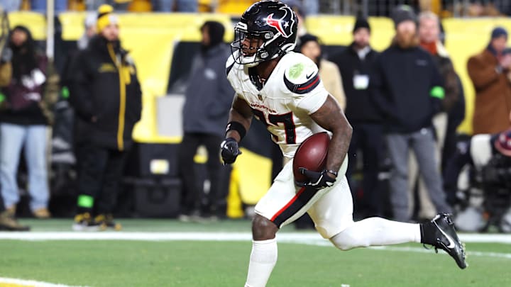 Jan 12, 2026; Pittsburgh, PA, USA; Houston Texans running back Woody Marks (27) scores a touchdown during the second half of an AFC Wild Card Round game against the Pittsburgh Steelers at Acrisure Stadium. Mandatory Credit: Charles LeClaire-Imagn Images