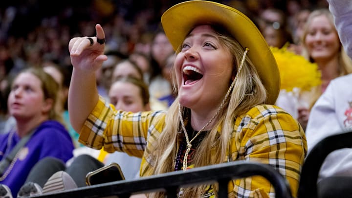 Julz Dunne, the sister of LSU Lady Tigers seniorLivvy Duane cheers for her sister against the Arkansas Razorbacks at Pete Maravich Assembly Center.