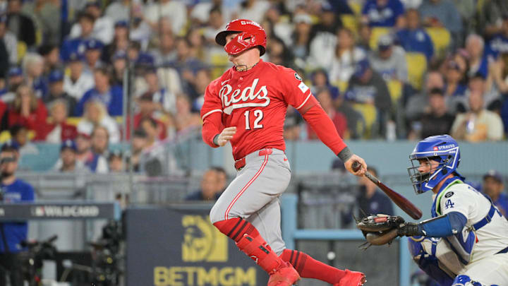 Sep 30, 2025; Los Angeles, California, USA; Cincinnati Reds left fielder Austin Hays (12) hits a single during the seventh inning against the Los Angeles Dodgers during game one of the Wildcard round for the 2025 MLB playoffs at Dodger Stadium. Mandatory Credit: Jayne Kamin-Oncea-Imagn Images Sep 30, 2025; Los Angeles, California, USA; Cincinnati Reds left fielder Austin Hays (12) hits a single during the seventh inning against the Los Angeles Dodgers during game one of the Wildcard round for the 2025 MLB playoffs at Dodger Stadium. Mandatory Credit: Jayne Kamin-Oncea-Imagn Images