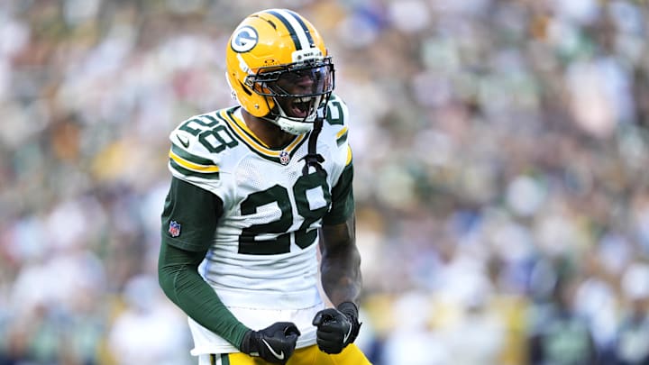 Aug 23, 2025; Green Bay, Wisconsin, USA; Green Bay Packers linebacker Isaiah Simmons (28) reacts to tackling Seattle Seahawks running back Jacardia Wright (31) during the second half at Lambeau Field. Mandatory Credit: Kayla Wolf-Imagn Images