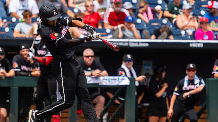 Jun 17, 2025; Omaha, Neb, USA; Louisville Cardinals third baseman Jake Munroe (20) hits a two-run home run against the Oregon State Beavers during the third inning at Charles Schwab Field. Mandatory Credit: Dylan Widger-Imagn Images Jun 17, 2025; Omaha, Neb, USA; Louisville Cardinals third baseman Jake Munroe (20) hits a two-run home run against the Oregon State Beavers during the third inning at Charles Schwab Field. Mandatory Credit: Dylan Widger-Imagn Images