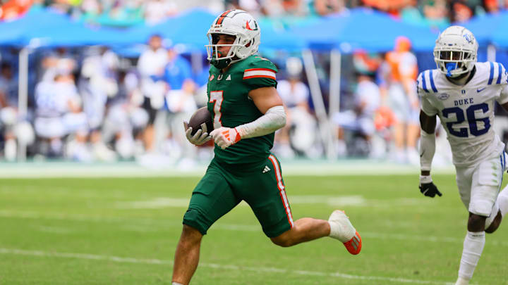 Nov 2, 2024; Miami Gardens, Florida, USA; Miami Hurricanes wide receiver Xavier Restrepo (7) runs with the football for a touchdown against the Duke Blue Devils during the fourth quarter at Hard Rock Stadium. Mandatory Credit: Sam Navarro-Imagn Images Nov 2, 2024; Miami Gardens, Florida, USA; Miami Hurricanes wide receiver Xavier Restrepo (7) runs with the football for a touchdown against the Duke Blue Devils during the fourth quarter at Hard Rock Stadium. Mandatory Credit: Sam Navarro-Imagn Images