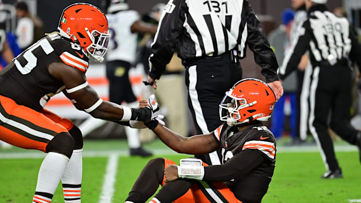 Nov 16, 2025; Cleveland, Ohio, USA; Cleveland Browns tight end David Njoku (85) helps up quarterback Shedeur Sanders (12) following a thrown interception during the third quarter against the Baltimore Ravens at Huntington Bank Field. Mandatory Credit: Ken Blaze-Imagn Images