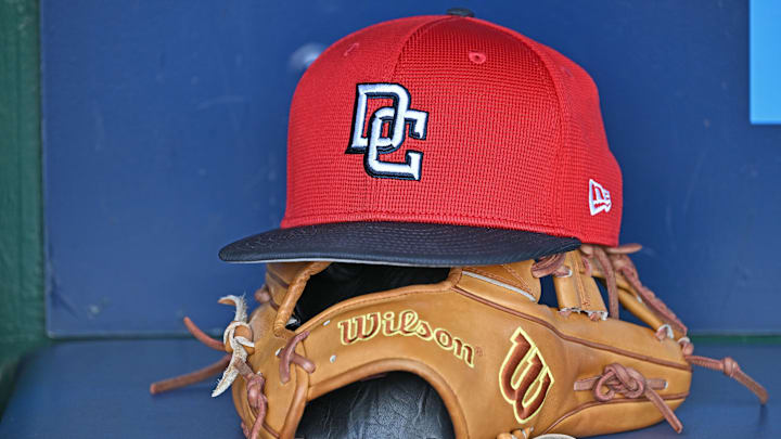 Aug 12, 2025; Kansas City, Missouri, USA; A Washington Nationals hat and glove in the dugout before a game against the Kansas City Royals at Kauffman Stadium. Mandatory Credit: Peter Aiken-Imagn Images Aug 12, 2025; Kansas City, Missouri, USA; A Washington Nationals hat and glove in the dugout before a game against the Kansas City Royals at Kauffman Stadium. Mandatory Credit: Peter Aiken-Imagn Images