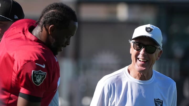 Jul 24, 2025; Henderson, NV, USA; Las Vegas Raiders quarterback Geno Smith (7) with coach Pete Carroll during training camp at the Intermountain Healthcare Performance Center. 
