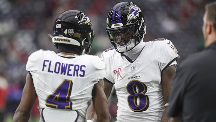 Dec 15, 2024; Houston, Texas, USA; Baltimore Ravens quarterback Lamar Jackson (8) shakes hands with wide receiver Zay Flowers (4) before the game against the Houston Texans at NRG Stadium. Mandatory Credit: Troy Taormina-Imagn Images