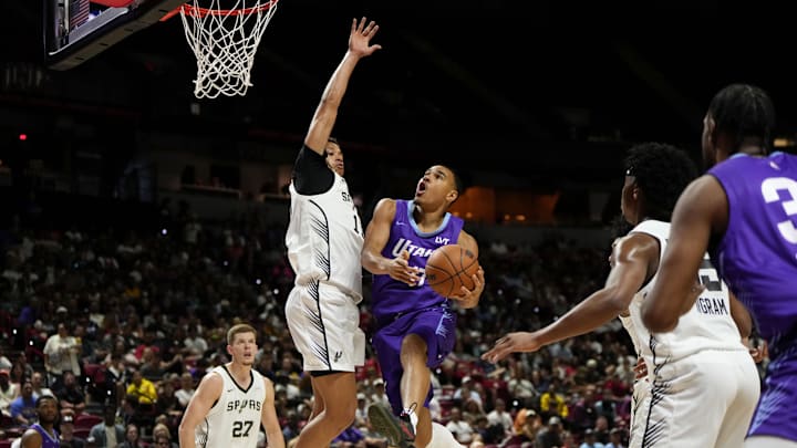 Jul 14, 2025; Las Vegas, NV, USA; Utah Jazz forward John Tonje (17) drives towards the basket against San Antonio Spurs forward Carter Bryant (11) during the first half of a NBA basketball game at the Thomas & Mack Center. Mandatory Credit: Lucas Peltier-Imagn Images Jul 14, 2025; Las Vegas, NV, USA; Utah Jazz forward John Tonje (17) drives towards the basket against San Antonio Spurs forward Carter Bryant (11) during the first half of a NBA basketball game at the Thomas & Mack Center. Mandatory Credit: Lucas Peltier-Imagn Images