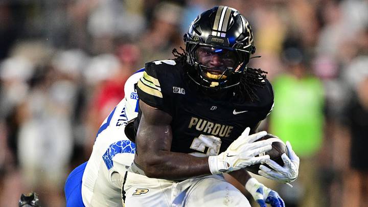Purdue Boilermakers running back Fame Ijeboi (2) avoids a tackle. Purdue Boilermakers running back Fame Ijeboi (2) avoids a tackle.
