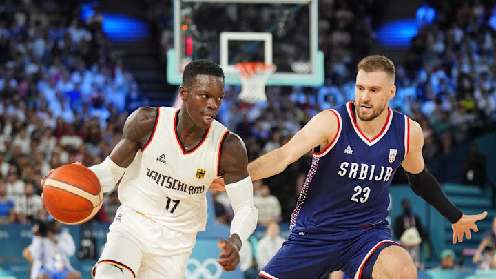 Aug 10, 2024; Paris, France; Germany point guard Dennis Schroder (17) dribbles the ball against Serbia shooting guard Marko Guduric (23) in the men's basketball bronze medal game during the Paris 2024 Olympic Summer Games at Accor Arena. Mandatory Credit: Rob Schumacher-USA TODAY Sports