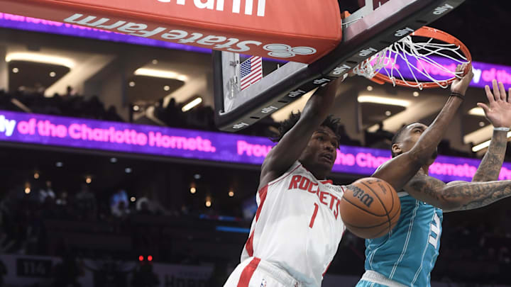 Dec 23, 2024; Charlotte, North Carolina, USA; Houston Rockets forward Amen Thompson (1) dunks past Charlotte Hornets guard DaQuan Jeffries (3) during the second half at the Spectrum Center. Mandatory Credit: Sam Sharpe-Imagn Images Dec 23, 2024; Charlotte, North Carolina, USA; Houston Rockets forward Amen Thompson (1) dunks past Charlotte Hornets guard DaQuan Jeffries (3) during the second half at the Spectrum Center. Mandatory Credit: Sam Sharpe-Imagn Images