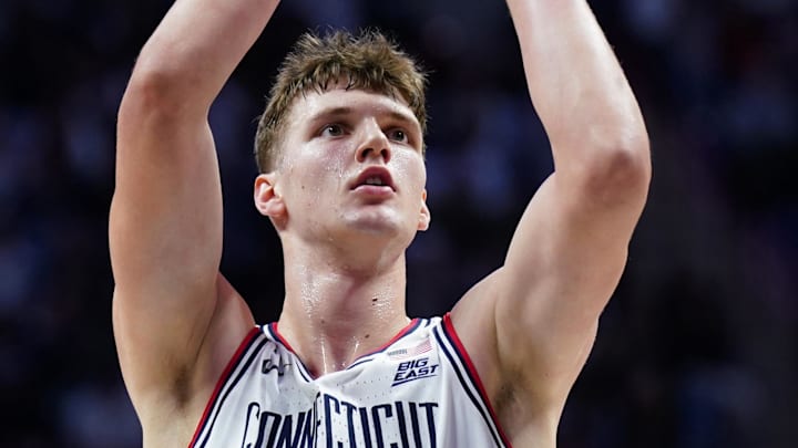 Dec 5, 2025; Storrs, Connecticut, USA; UConn Huskies center Eric Reibe (12) throws a free-throw against the East Texas A&M Lions in the first half at Harry A. Gampel Pavilion. Mandatory Credit: David Butler II-Imagn Images