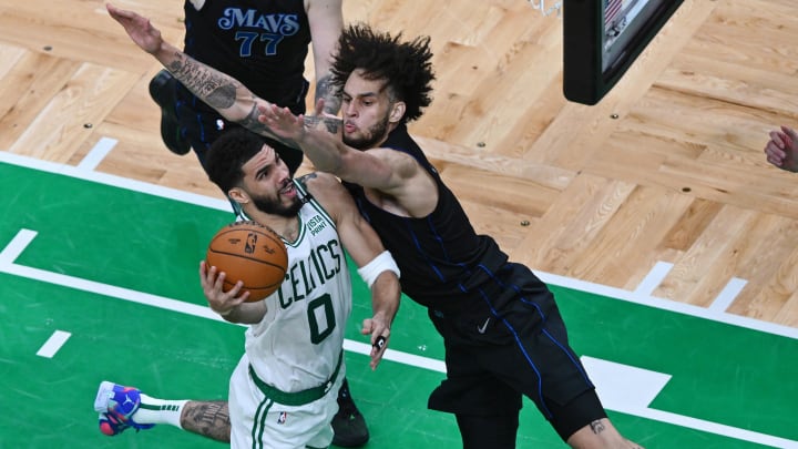 Jun 6, 2024; Boston, Massachusetts, USA; Dallas Mavericks center Dereck Lively II (2) fouls Boston Celtics forward Jayson Tatum (0) during the second half of game one of the 2024 NBA Finals at TD Garden. Mandatory Credit: Peter Casey-USA TODAY Sports