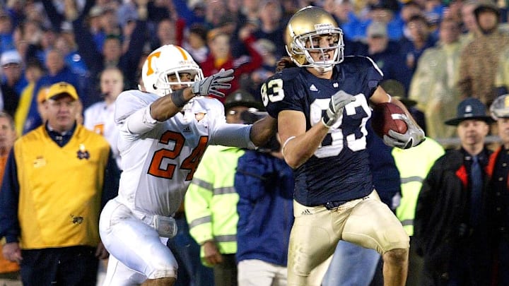 Nov  5, 2005; South Bend, IN, USA; Notre Dame Fighting Irish #83 Jeff Samardzija outruns Tennessee Volunteers #24 Antwan Stewart after a long pass play in the third quarter. Irish beat the Volunteers 41-21. 