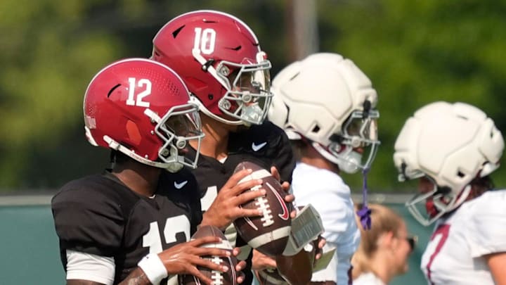 Aug. 19, 2025, Tuscaloosa, AL; Quarterbacks Keelon Russell and Austin Mack throw during practice for the Alabama Crimson Tide.