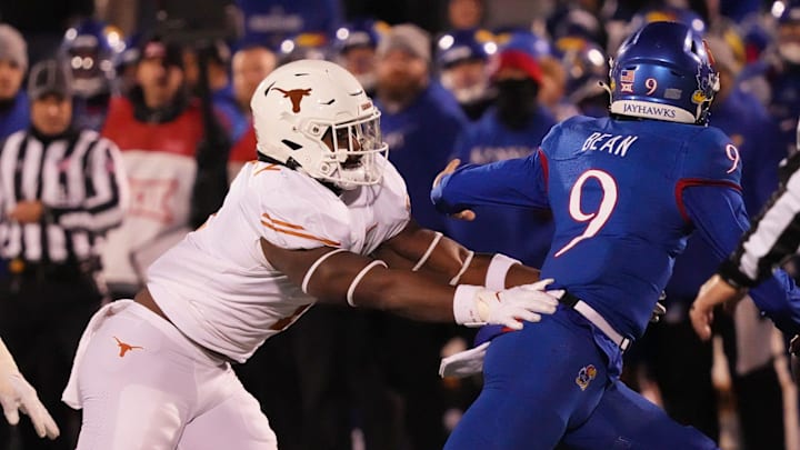 Texas Longhorns defensive end Justice Finkley (1) pressures Kansas Jayhawks quarterback Jason Bean (9)  during the Texas Longhorns football game against the Kansas Jayhawks in Lawrence, Kansas on Saturday, Nov. 19, 2022.

Ut Ku Football Mlc 01255