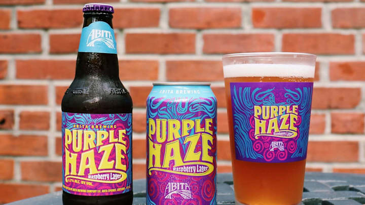 Abita Brewing Co. Purple Haze beer sitting atop an outdoor pation set ready to quench thirsts.