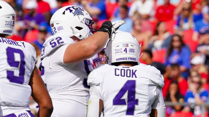 Sep 28, 2024; Kansas City, Missouri, USA; TCU Horned Frogs running back Cam Cook (4) celebrates with offensive lineman James Brockermeyer (52) after scoring against the Kansas Jayhawks during the first half at GEHA Field at Arrowhead Stadium. Mandatory Credit: Denny Medley-Imagn Images
