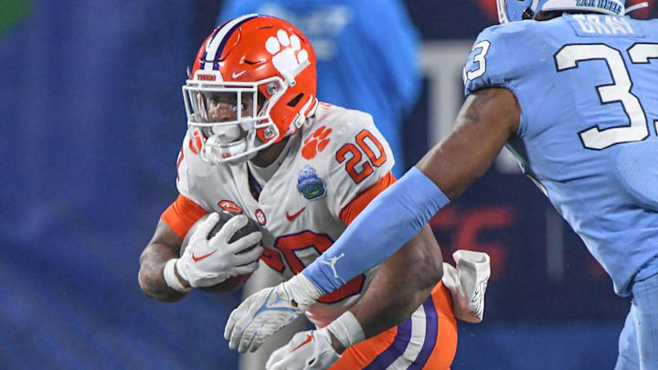 Clemson running back Domonique Thomas (20) runs during the fourth quarter of the ACC Championship