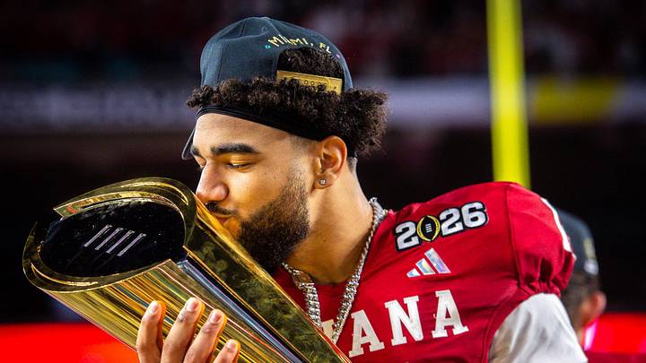Indiana's Elijah Sarratt (13) kisses the trophy after the College Football Playoff National Championship college football game at Hard Rock Stadium in Miami Gardens on Monday, Jan. 19, 2026. Indiana's Elijah Sarratt (13) kisses the trophy after the College Football Playoff National Championship college football game at Hard Rock Stadium in Miami Gardens on Monday, Jan. 19, 2026.