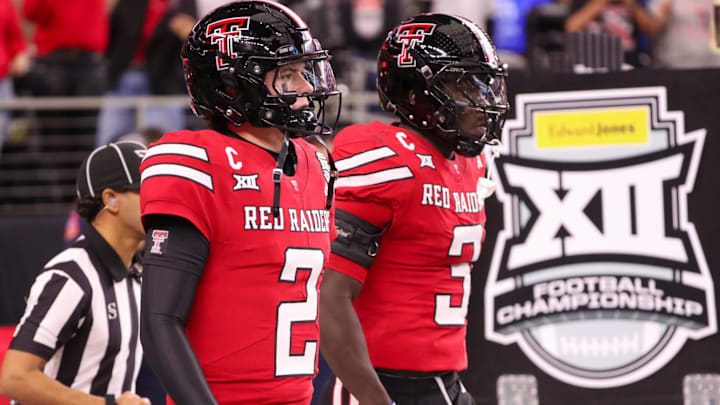 Texas Tech seniors Behren Morton (2) and Bryce Ramirez walk to the field before the Big 12 Conference championship football game, Saturday, Nov. 6, 2025, at AT&T Stadium in Arlington.
