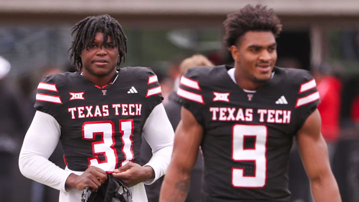David Bailey (31) and Romello Height walk to the field before the Texas Tech football team's spring game, Saturday, April 19, 2025, at Jones AT&T Stadium.