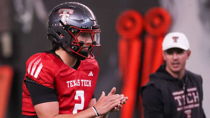 Texas Tech's Brendan Sorsby goes through a drill as offensive coordinator Mack Leftwich looks on during spring football practice, Tuesday, March 24, 2026, at the Womble Football Center.
