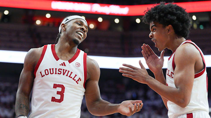 Louisville Cardinals guard Ryan Conwell (3) laughs with Louisville Cardinals guard Mikel Brown Jr. (0) in the first half at the KFC Yum! Center in downtown Louisville February 9, 2026.