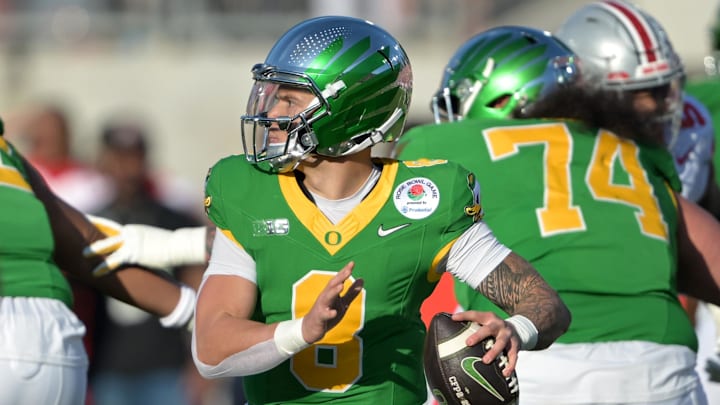 Jan 1, 2025; Pasadena, CA, USA; Oregon Ducks quarterback Dillon Gabriel (8) throws a pass in the first half against the Ohio State Buckeyes in the 2025 Rose Bowl college football quarterfinal game at Rose Bowl Stadium. Mandatory Credit: Jayne Kamin-Oncea-Imagn Images