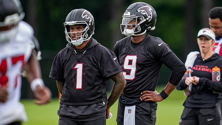 Jun 16, 2026; Atlanta, GA, USA; Atlanta Falcons quarterbacks Tua Tagovailoa (1) and  Michael Penix Jr. (9) on the field during Minicamp. Mandatory Credit: Dale Zanine-Imagn Images