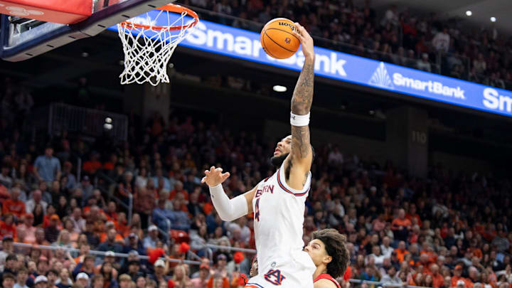 Auburn Tigers forward Johni Broome (4) dunks the ball as Auburn Tigers take on Georgia Bulldogs at Neville Arena in Auburn, Ala., on Saturday, Feb. 22, 2025. Auburn Tigers defeated Georgia Bulldogs 82-70.