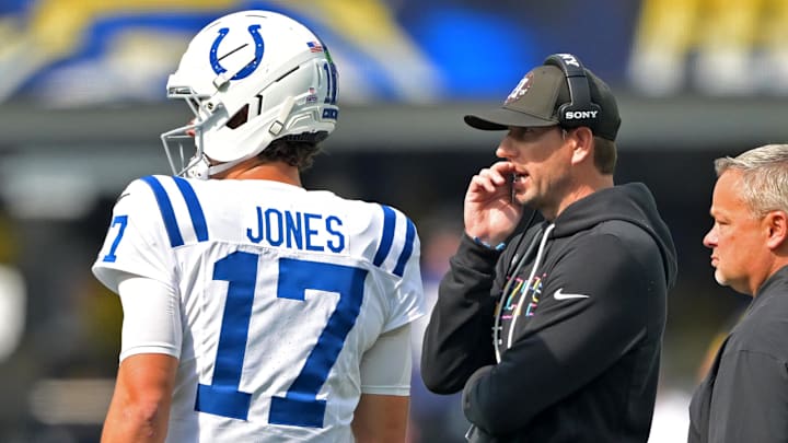 Oct 19, 2025; Inglewood, California, USA; Indianapolis Colts quarterback Daniel Jones (17) talks with head coach Shane Steichen during a stoppage in play in the first half against the Los Angeles Chargers at SoFi Stadium. 