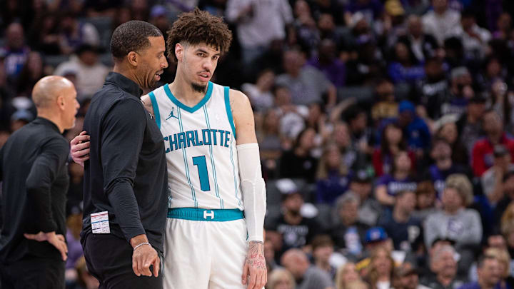Feb 24, 2025; Sacramento, California, USA; Charlotte Hornets head coach Charles Lee talks with guard LaMelo Ball (1) during a time out in the fourth quarter of the game against the Sacramento Kings at Golden 1 Center. Mandatory Credit: Ed Szczepanski-Imagn Images