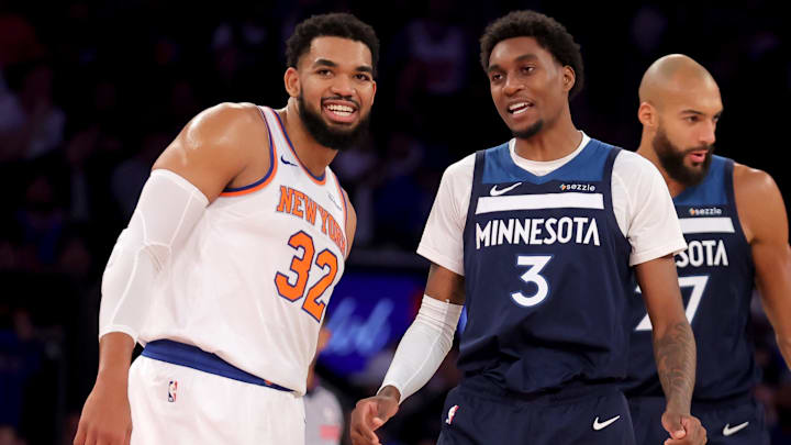 Nov 5, 2025; New York, New York, USA; Minnesota Timberwolves forward Jaden McDaniels (3) talks to New York Knicks center Karl-Anthony Towns (32) during the first quarter at Madison Square Garden.