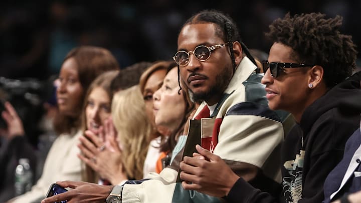 Oct 1, 2024; Brooklyn, New York, USA;  Former NBA forward Carmelo Anthony and his son Kyian Anthony during game two of the 2024 WNBA Semi-finals at Barclays Center. Mandatory Credit: Wendell Cruz-Imagn Images