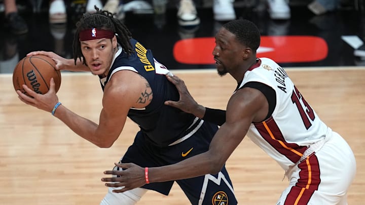 Jun 9, 2023; Miami, Florida, USA; Denver Nuggets forward Aaron Gordon (50) controls the ball while defended by Miami Heat center Bam Adebayo (13) during the second half in game four of the 2023 NBA Finals at Kaseya Center.