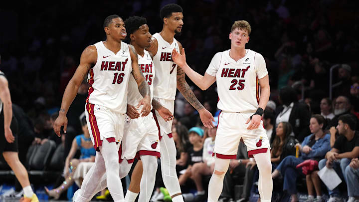 Oct 8, 2025; Miami, Florida, USA; Miami Heat guard Kasparas Jakucionis (25) is congratulated by forward Keshad Johnson (16), forward Myron Gardner (15) and center Kel'El Ware (7) during a timeout in the second half against the San Antonio Spurs at Kaseya Center. Mandatory Credit: Jim Rassol-Imagn Images Oct 8, 2025; Miami, Florida, USA; Miami Heat guard Kasparas Jakucionis (25) is congratulated by forward Keshad Johnson (16), forward Myron Gardner (15) and center Kel'El Ware (7) during a timeout in the second half against the San Antonio Spurs at Kaseya Center. Mandatory Credit: Jim Rassol-Imagn Images